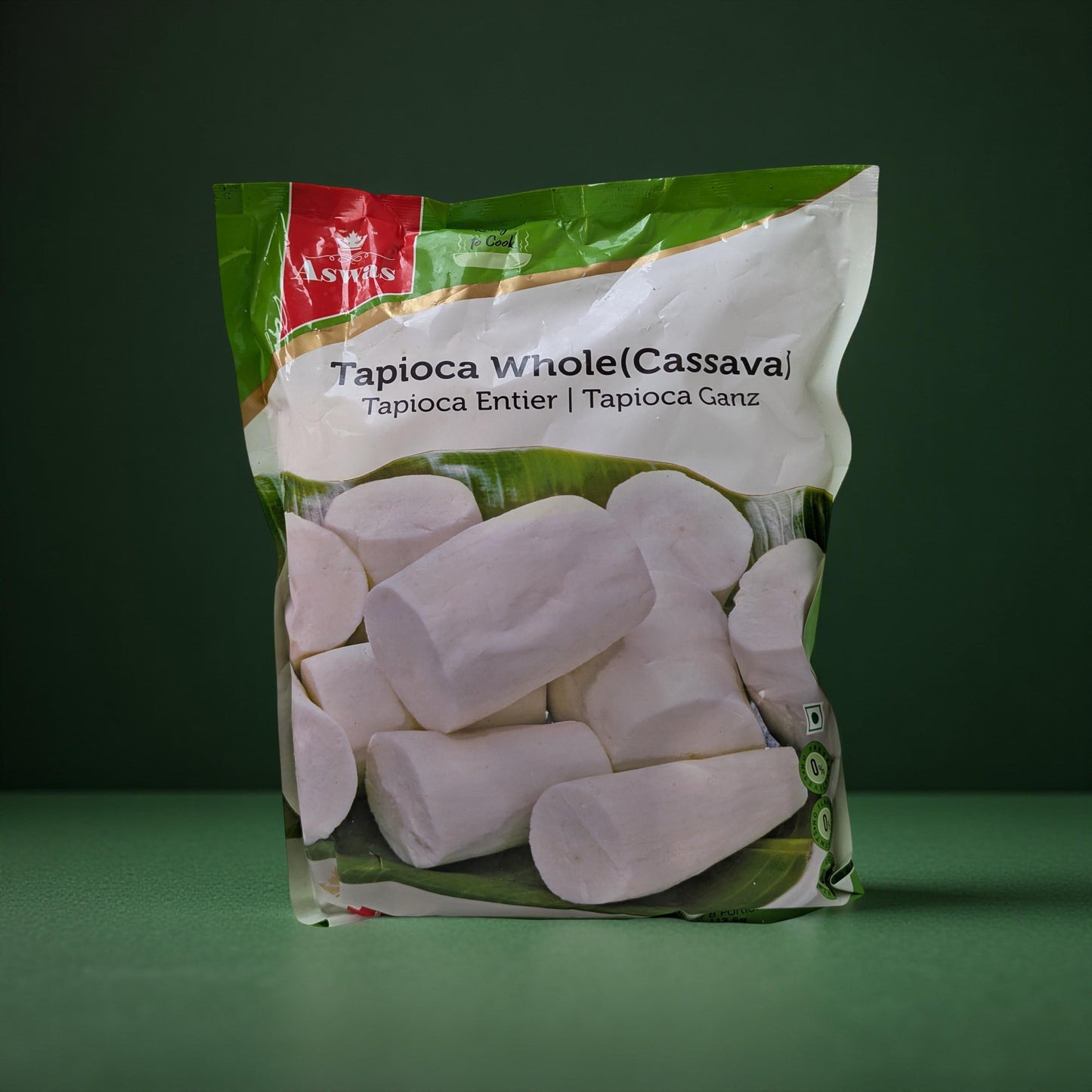 Packaged tapioca whole cassava with a green background