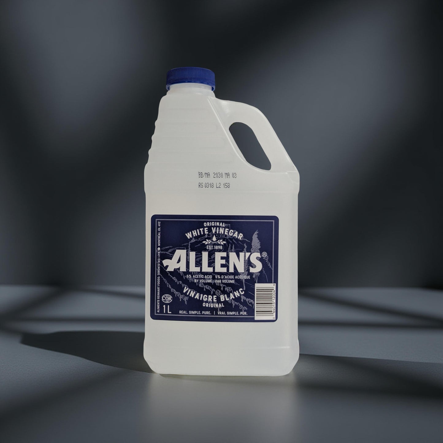 Bottle of Allen's white vinegar on a dark background