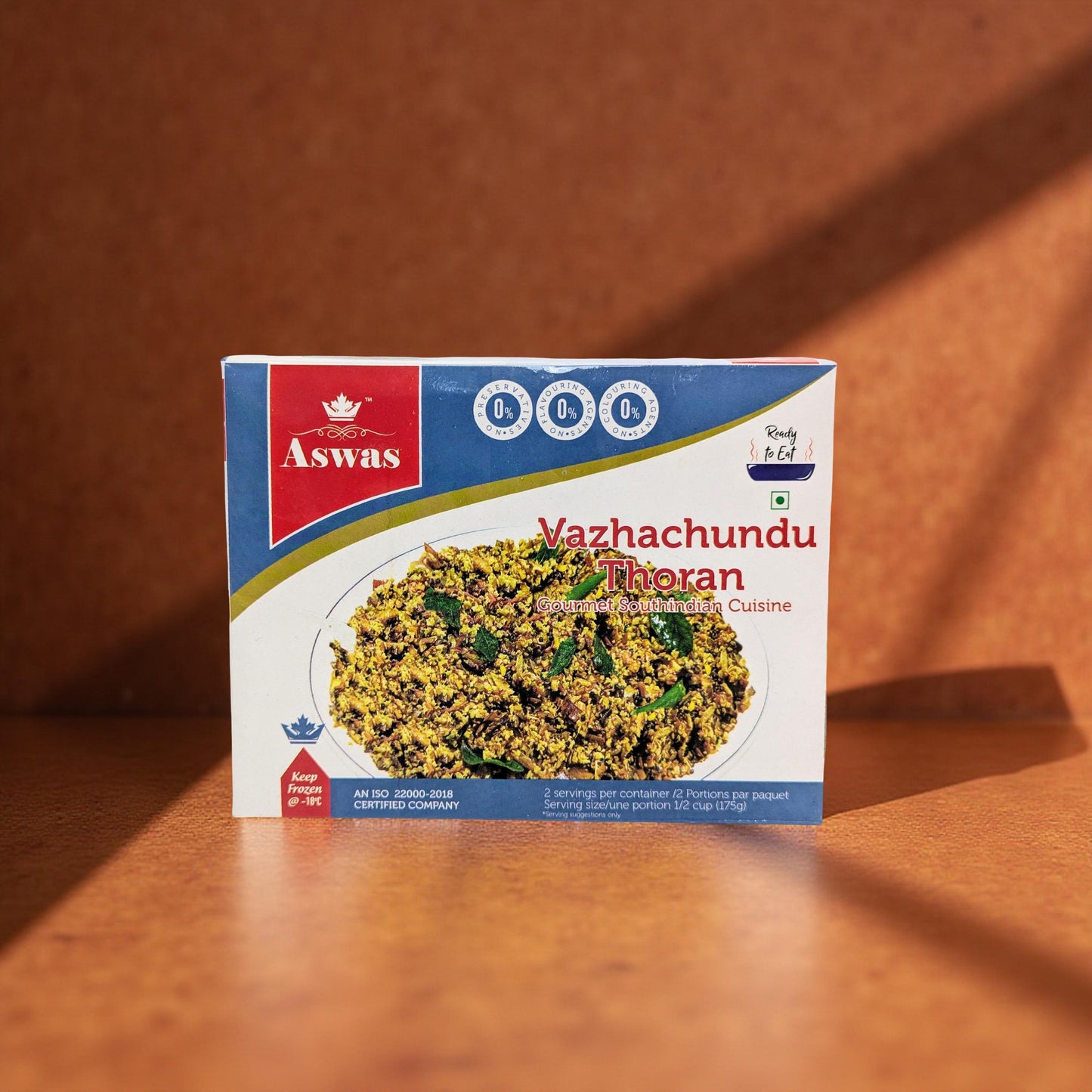 Aswas Vazhachundu Thoran packaging on a wooden surface