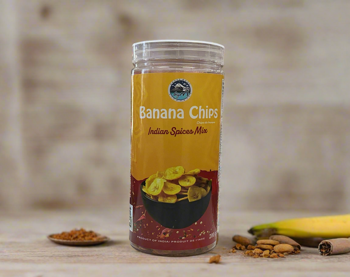 Jar of Banana Chips Indian Spices Mix on a wooden surface with a blurred background