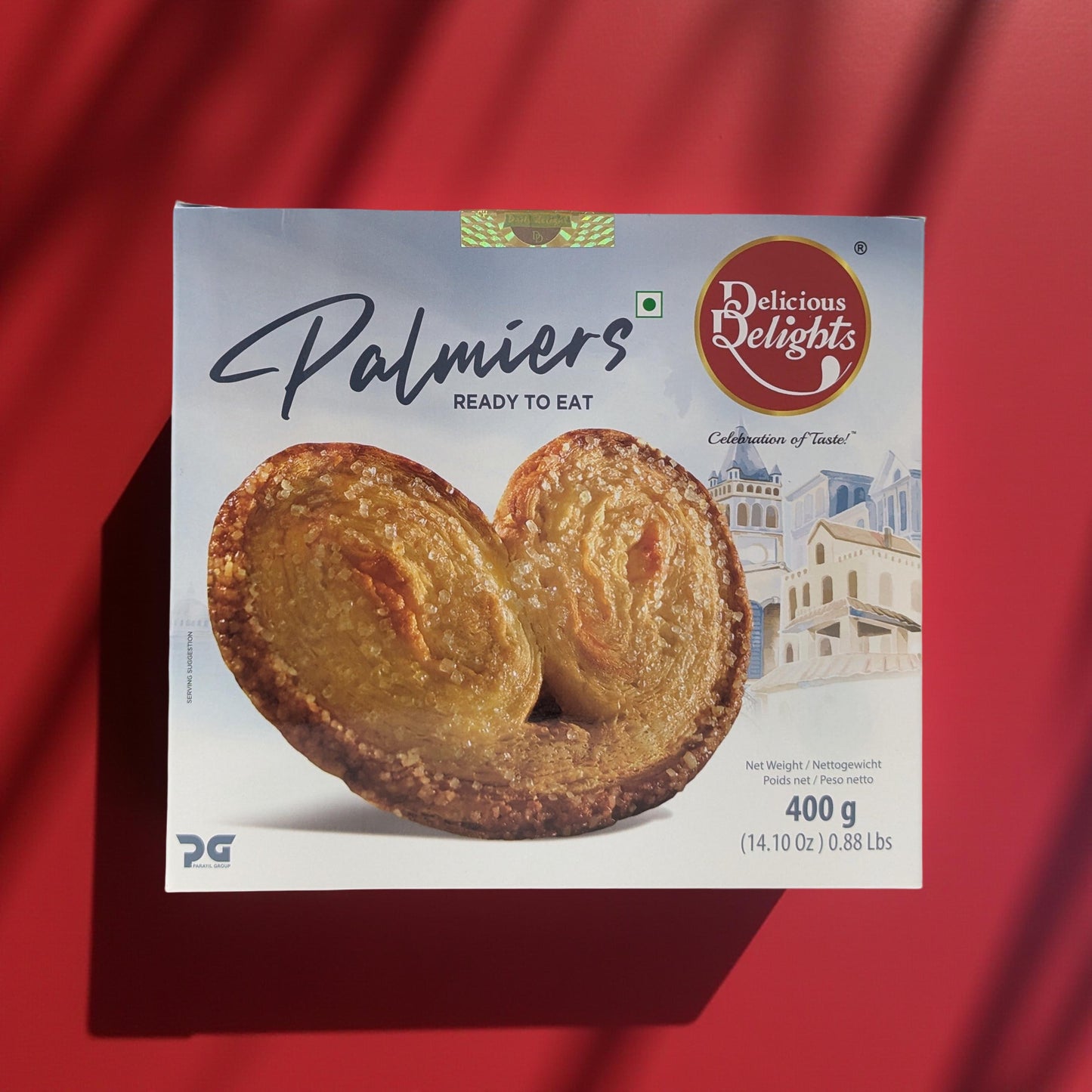 Box of Delicious Delights Palmiers on a red background