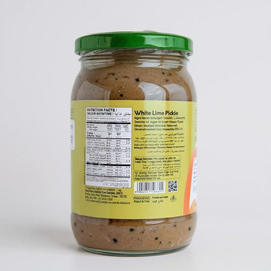 Jar of White Lime Pickle with label on a white background