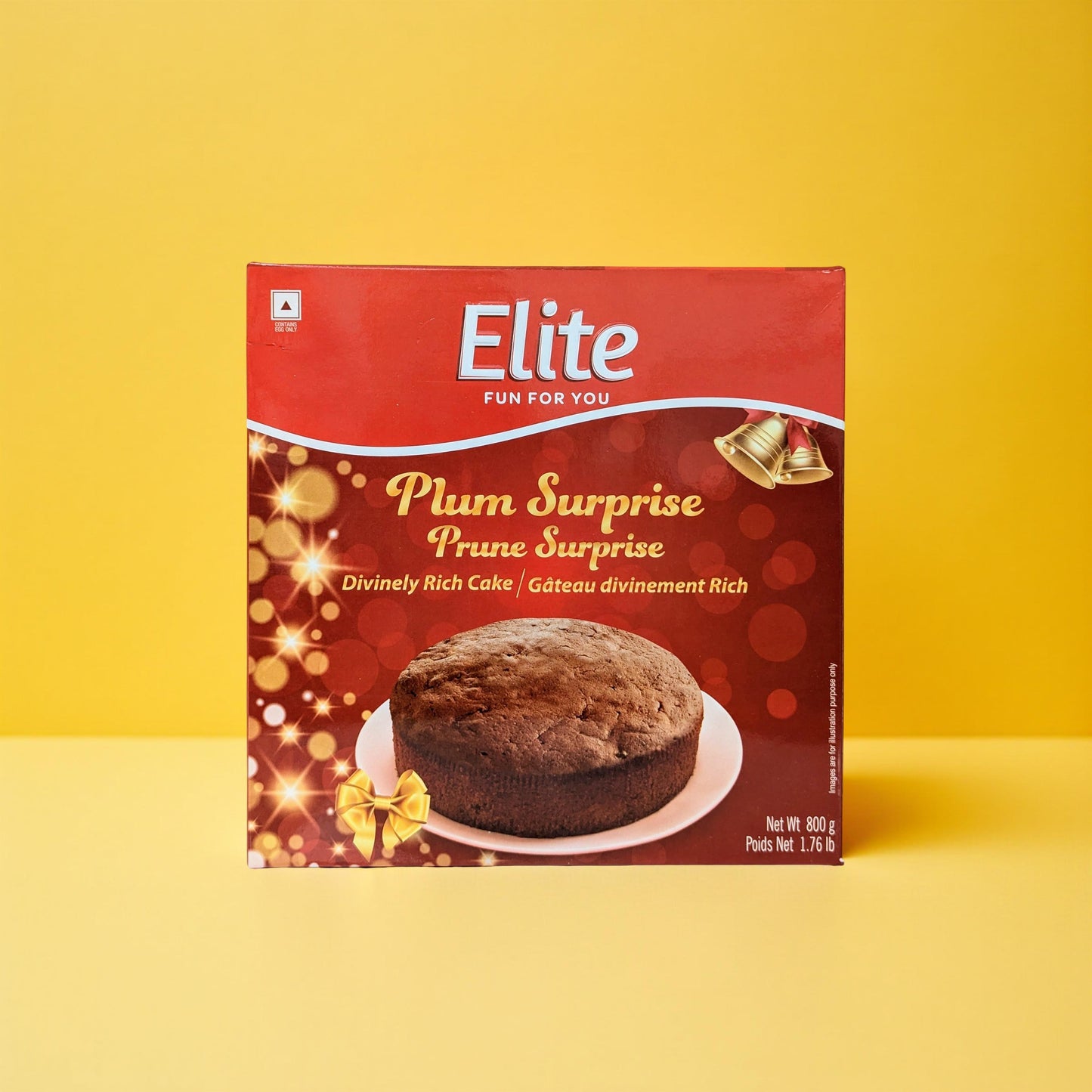 Elite Plum Surprise Prune Surprise cake packaging on a yellow background