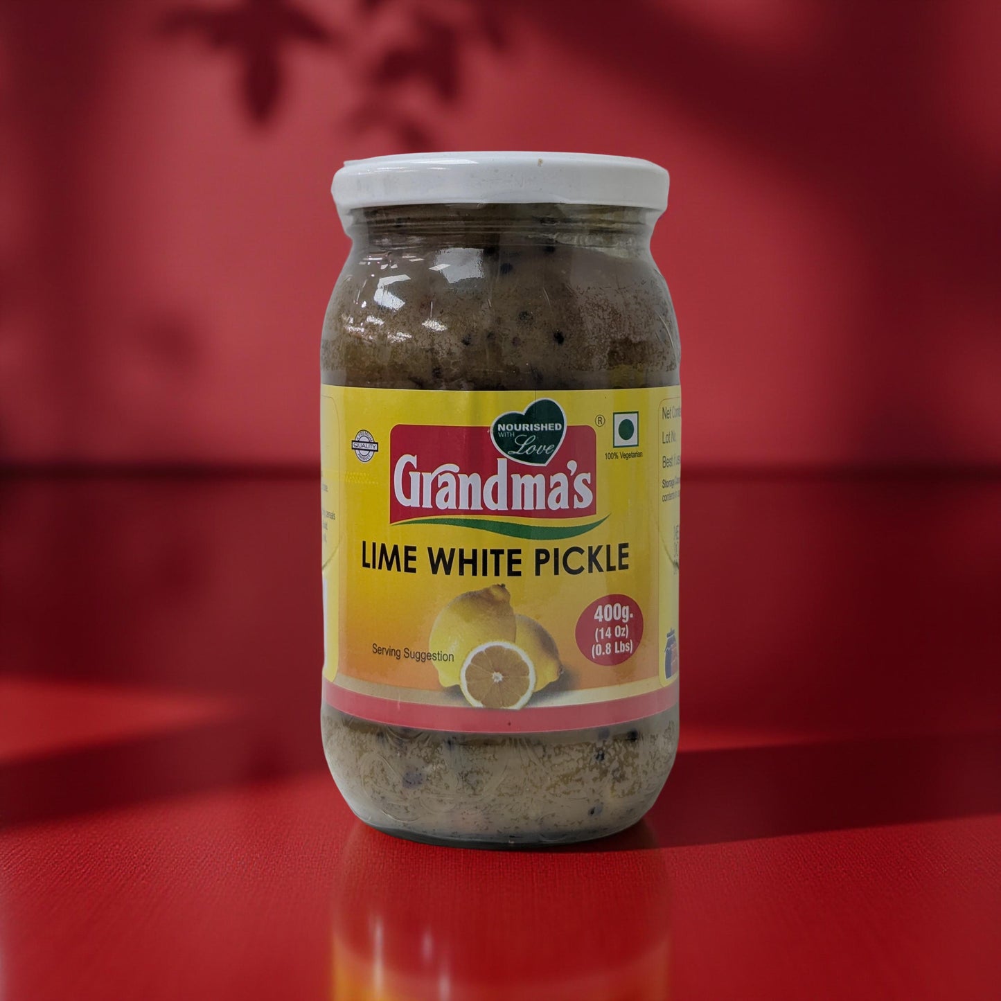 Jar of Grandma's Lime White Pickle on a red background
