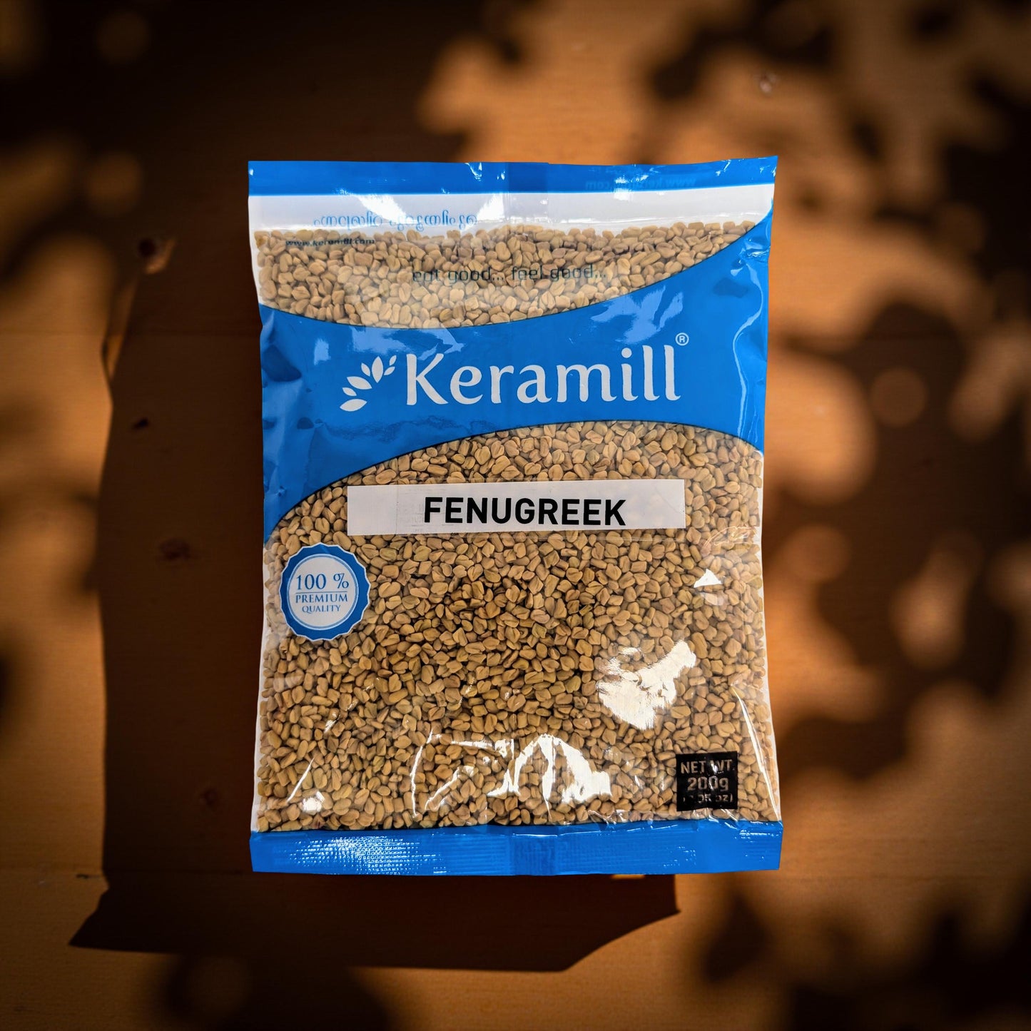 Keramill fenugreek package on a wooden surface