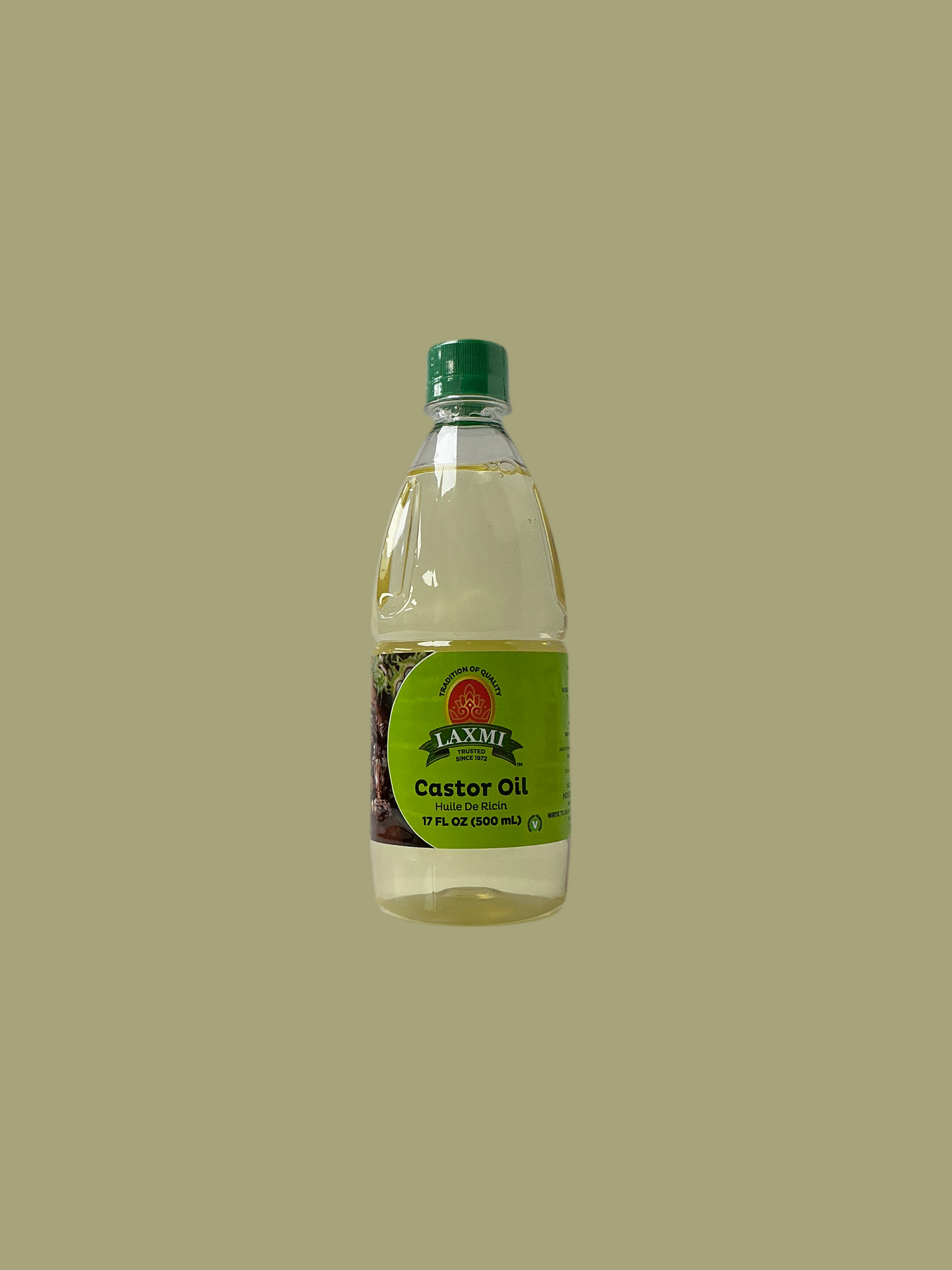 Bottle of Laxmi Castor Oil on a beige background