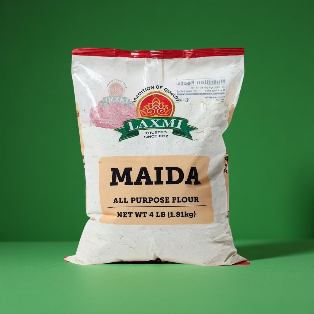 Bag of Laxmi Maida all-purpose flour on a green background