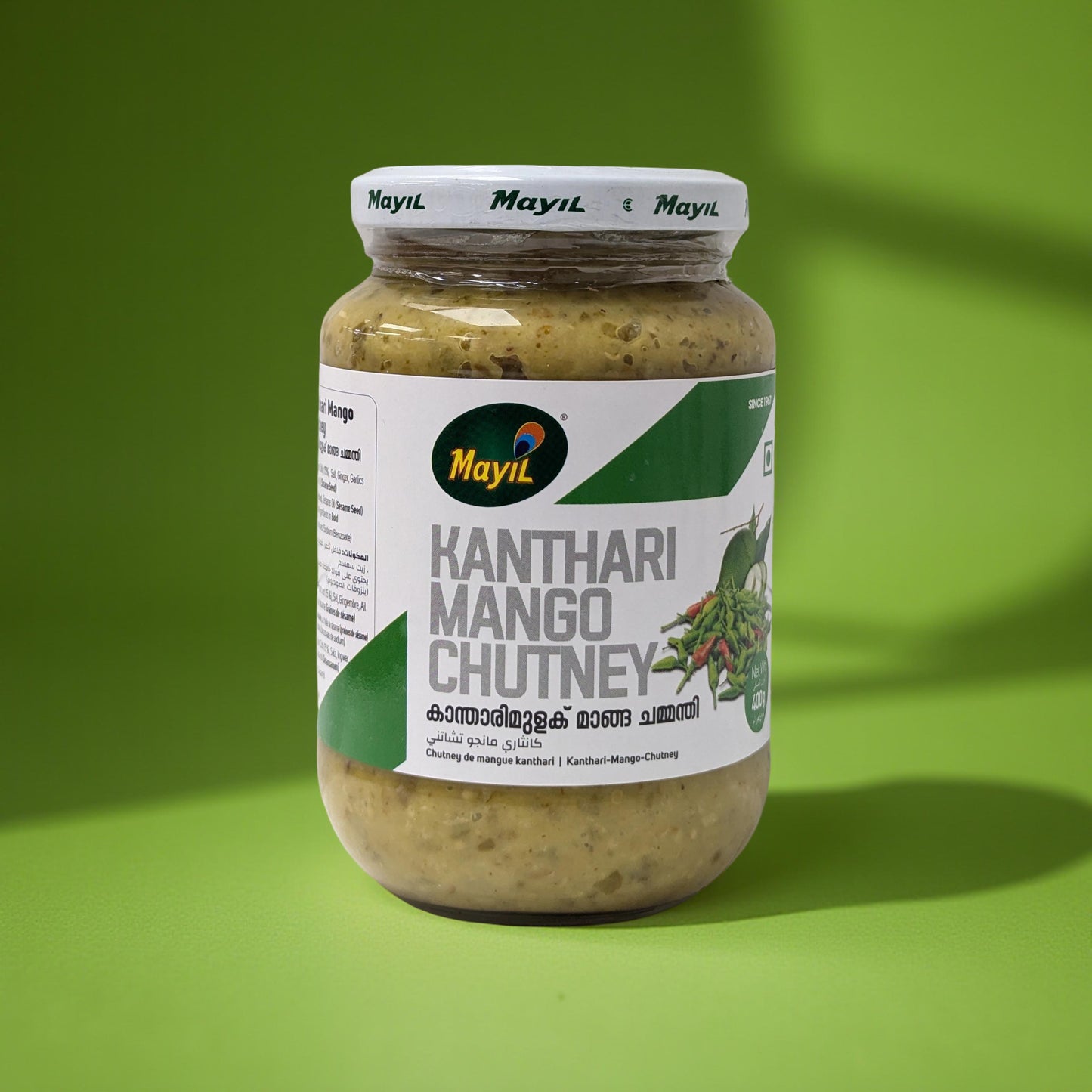 Jar of Kanthari Mango Chutney with Mayil brand on a green background