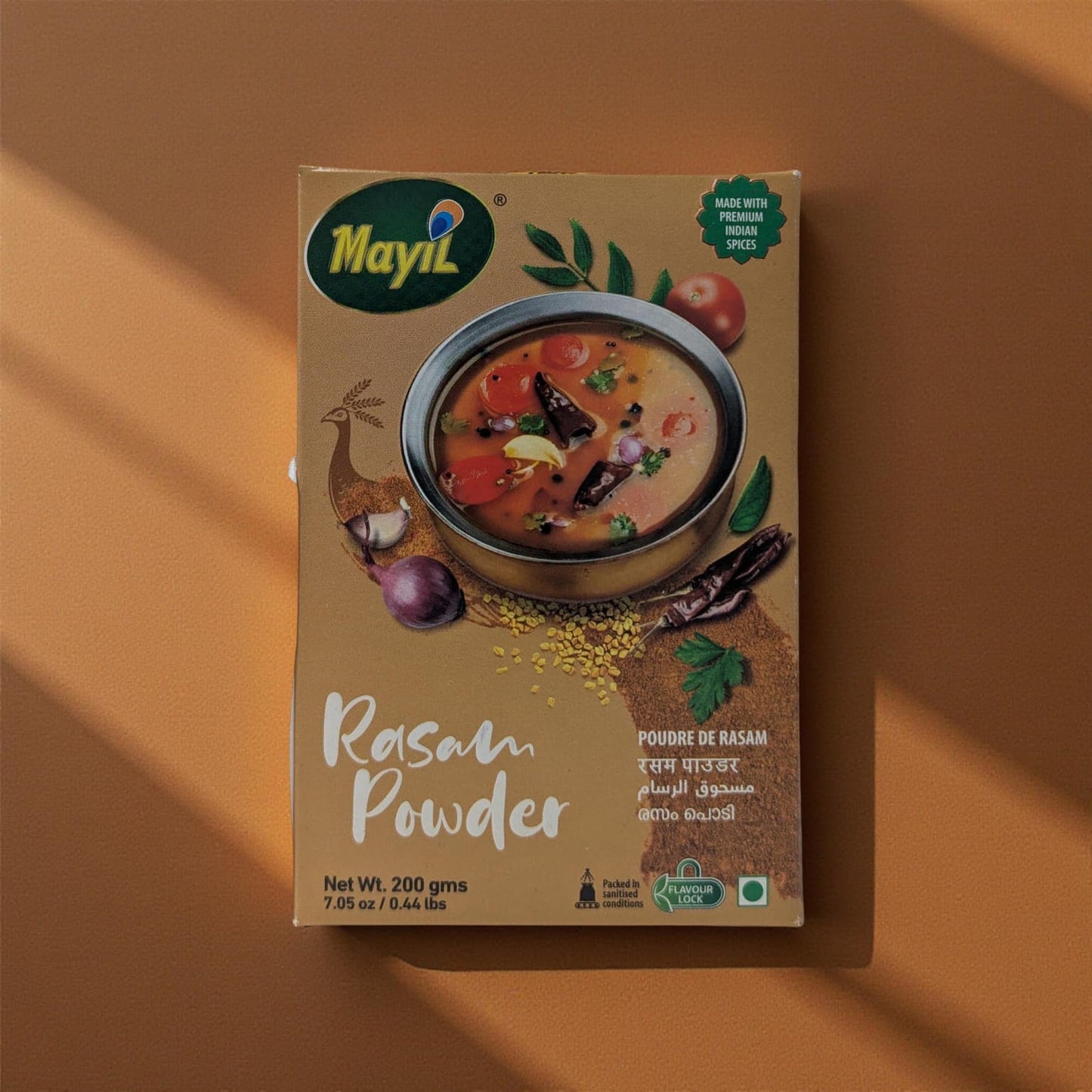 Mayil Rasam Powder packaging on a brown background