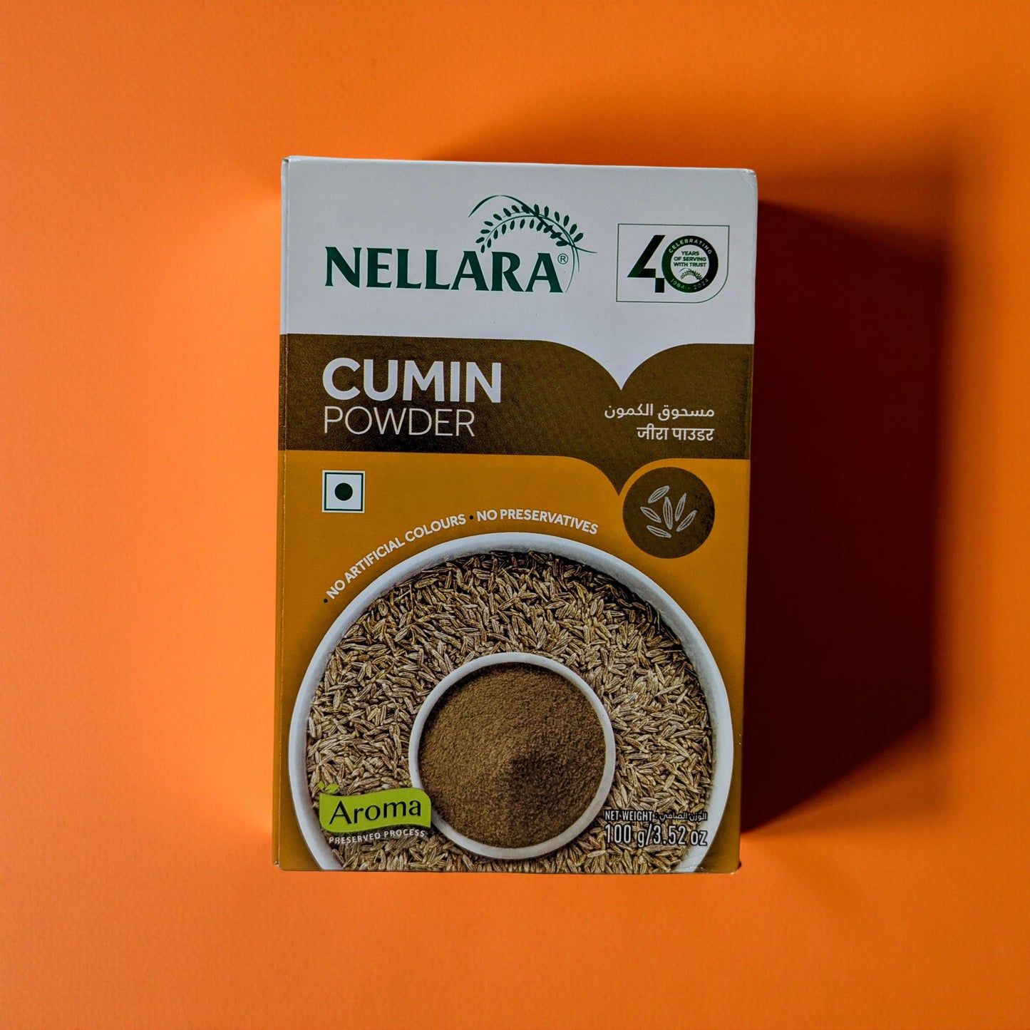 Nellara Cumin Powder packaging on an orange background