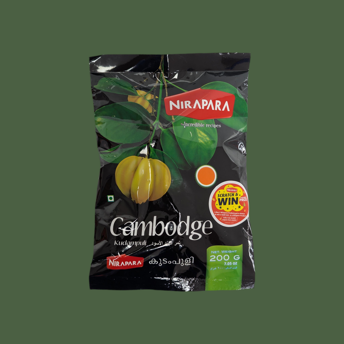 Nirapara Cambodge Kudamppuli package with green leaves on a transparent background