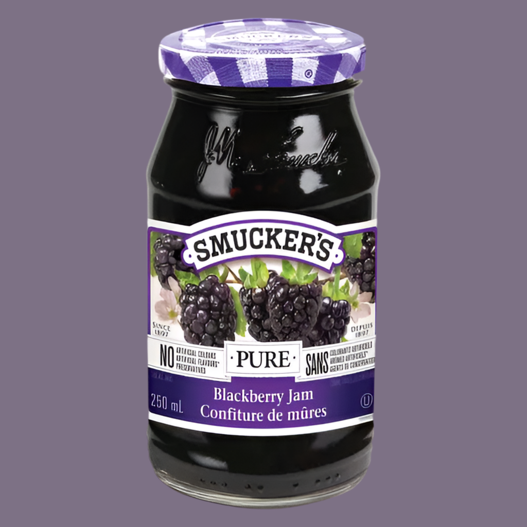 Jar of Smucker's Blackberry Jam on a gray background