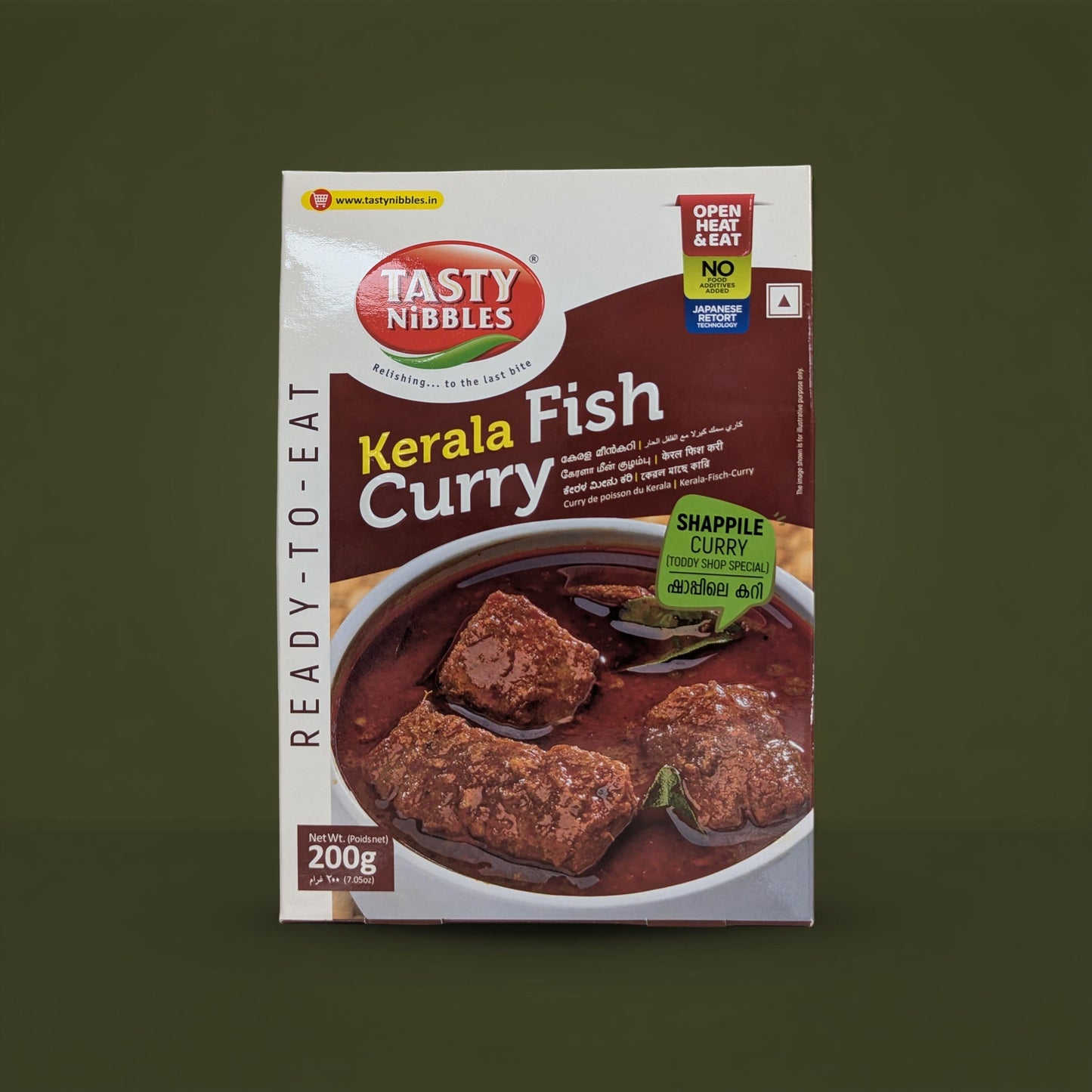Tasty Nibbles Kerala Fish Curry packaging on a dark green background
