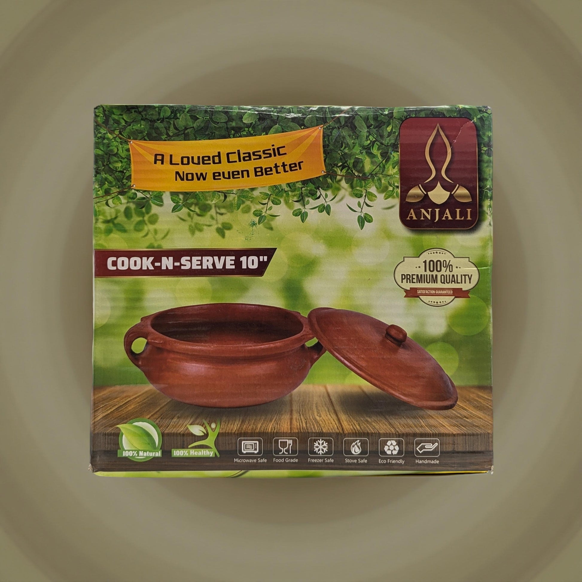Anjali cookware packaging with a pot on a wooden surface