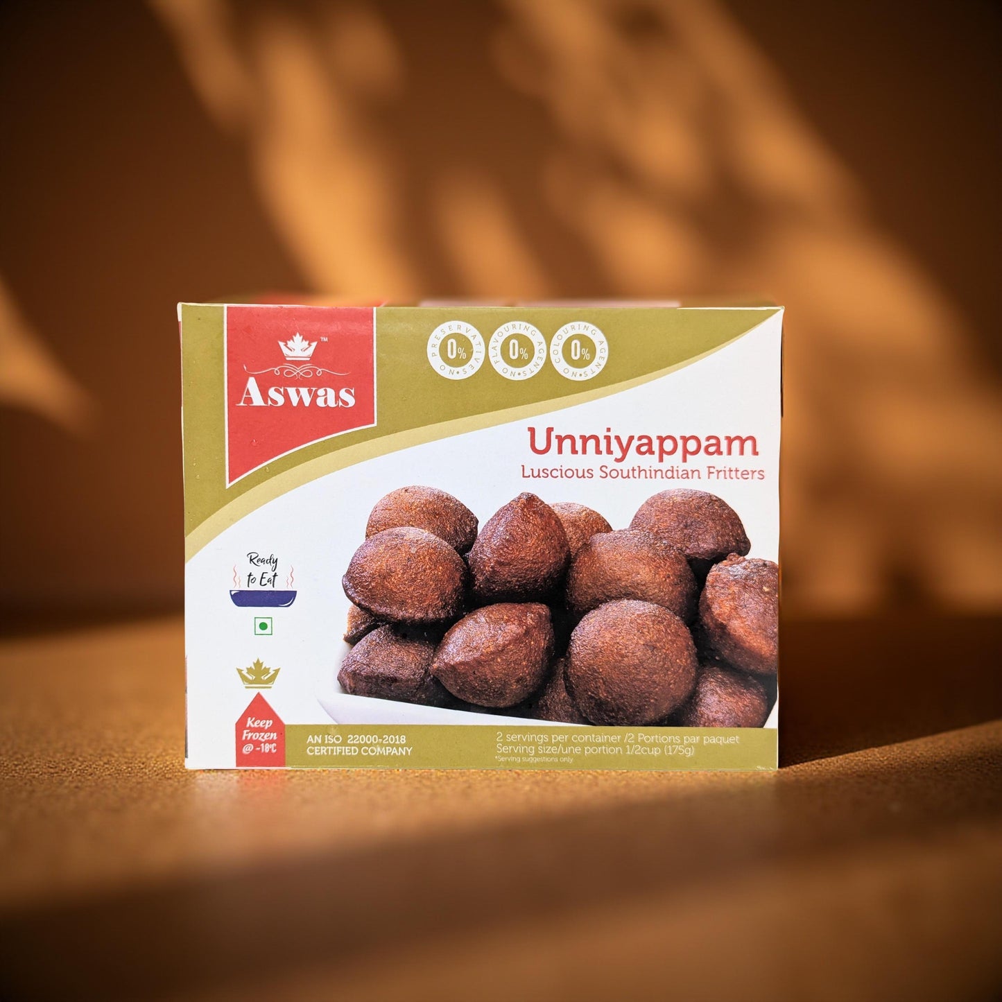 Aswas Unniyappam packaging on a wooden surface