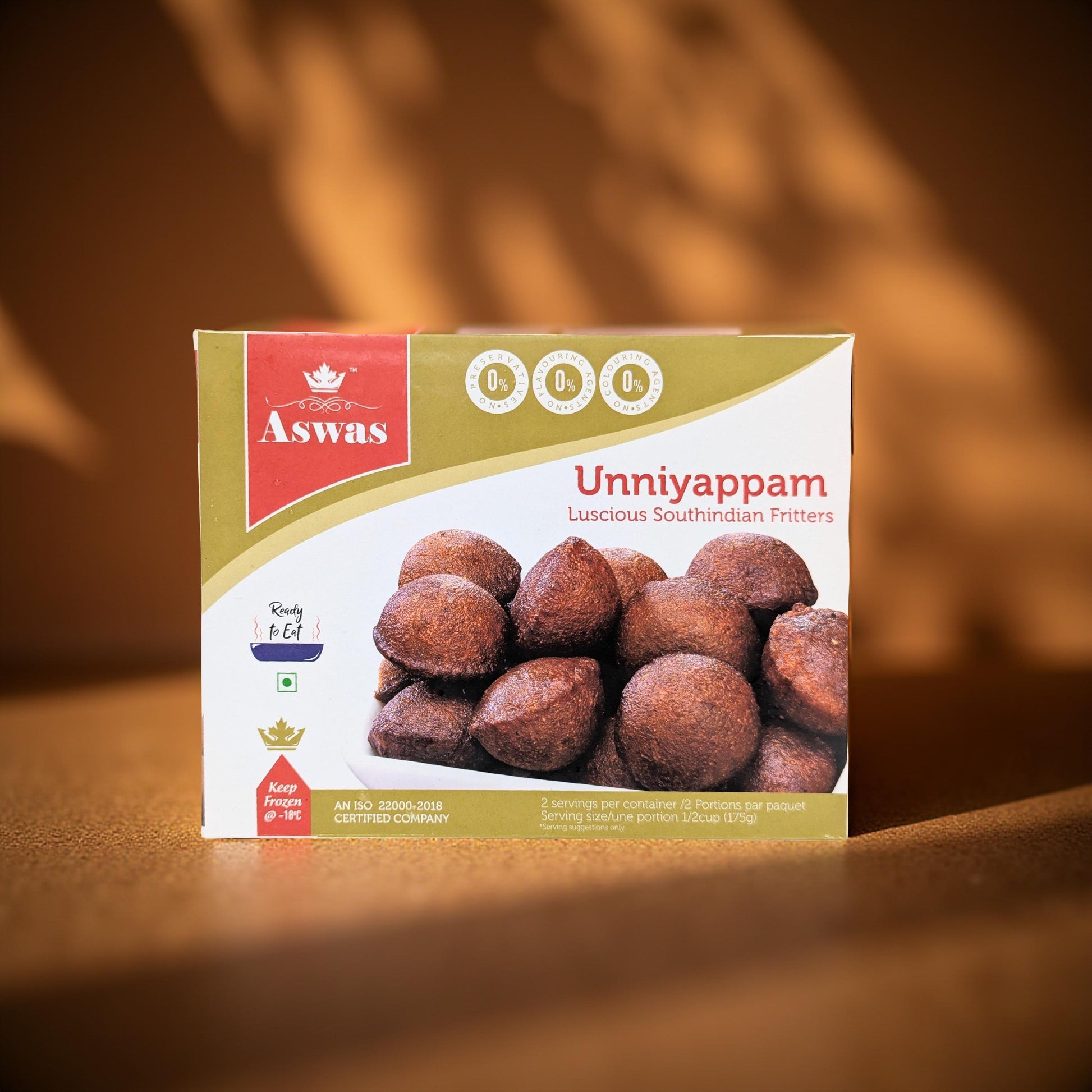 Aswas Unniyappam packaging on a wooden surface