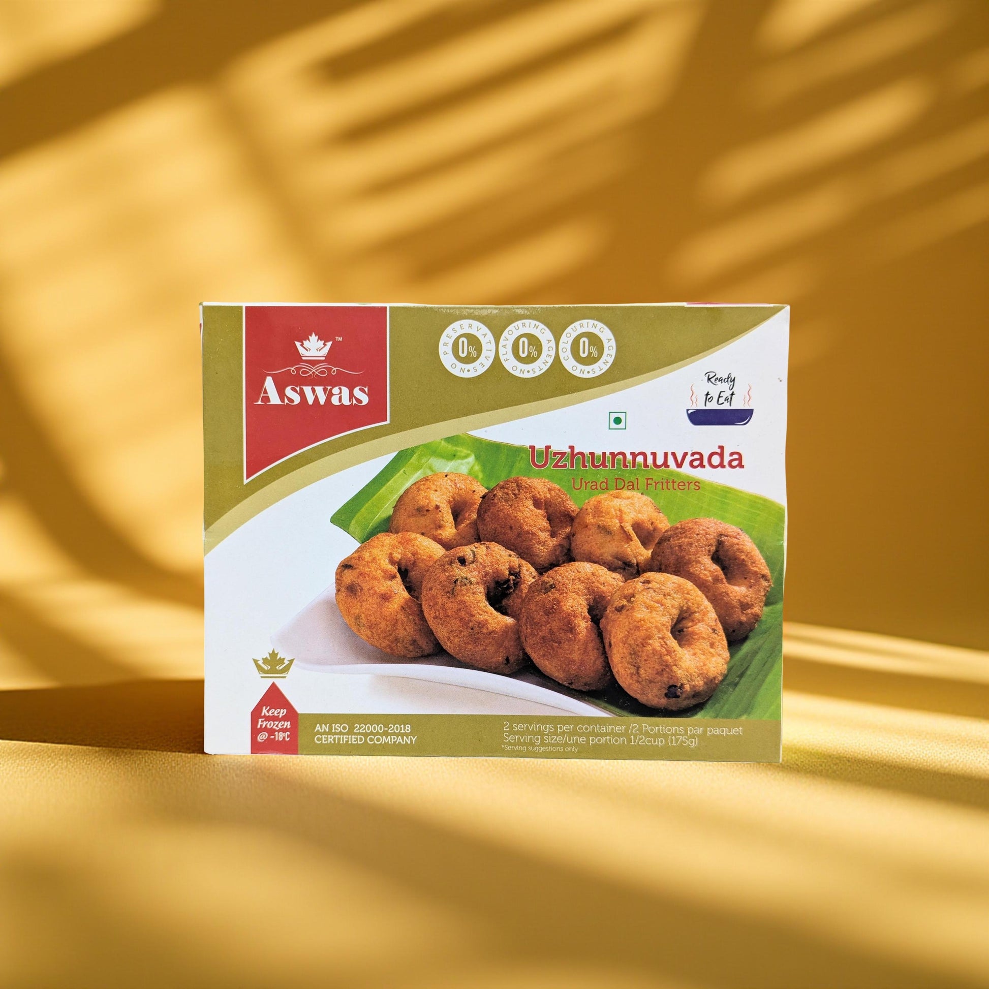 Aswas Uzhunnuvada packaging on a gold background