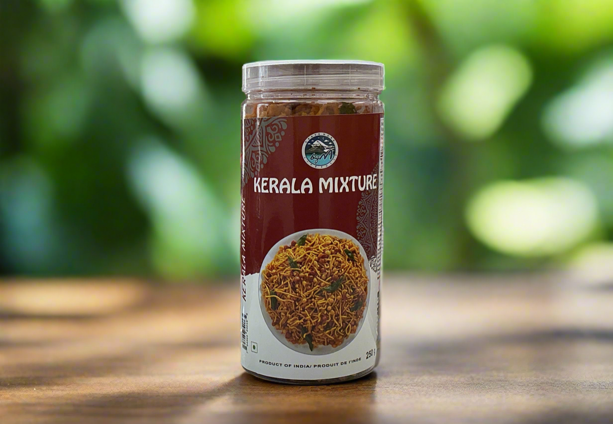Jar of Kerala Mixture on a wooden surface with a blurred green background