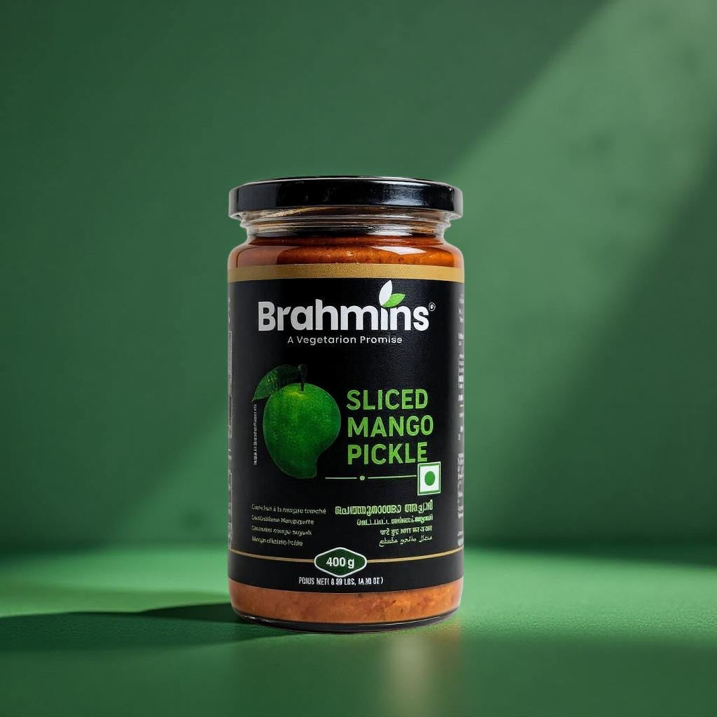 Jar of Brahmins Sliced Mango Pickle on a green background
