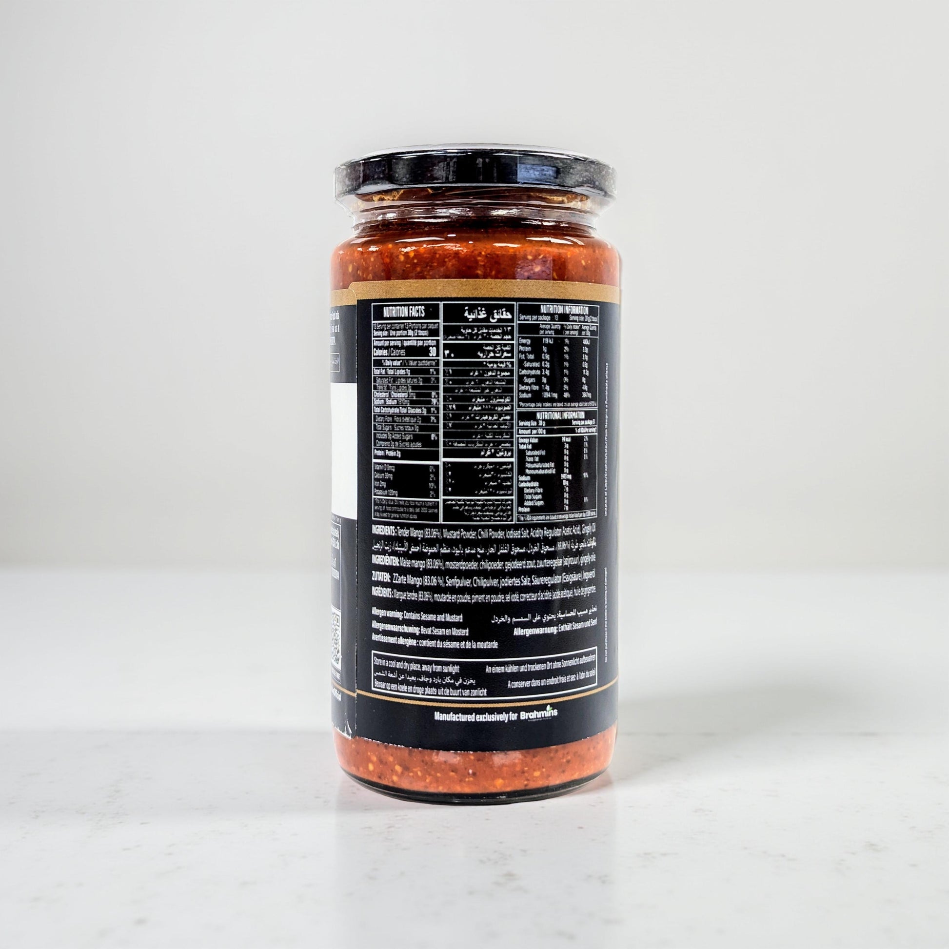 Jar of pasta sauce with a black label on a white background