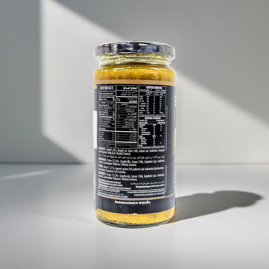 Jar of food with nutritional information label on a gray background