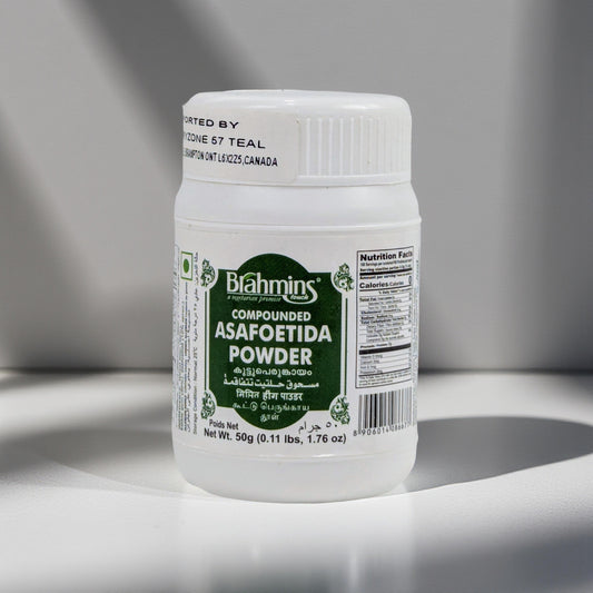 Bottle of Blahmings compounded asafoetida powder on a gray background
