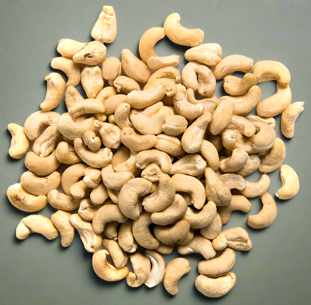 Pile of cashews on a gray background