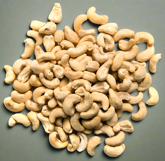 Pile of cashews on a gray background