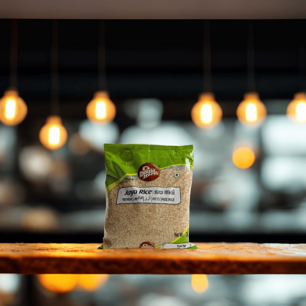 Bag of Jaya Rice on a wooden surface with a blurred background of lights