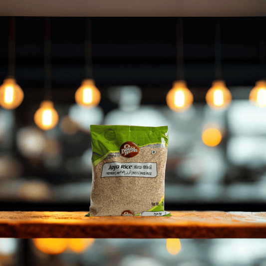 Bag of Jaya Rice on a wooden surface with a blurred background of lights