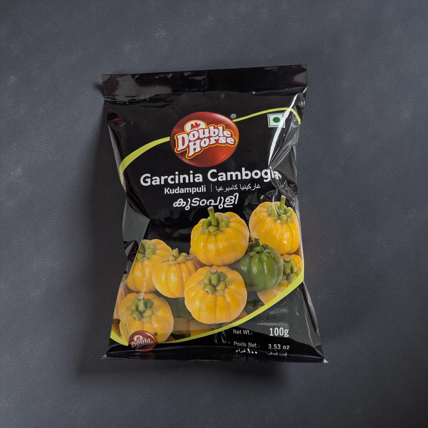 Packaged Garcinia Cambogia on a dark background
