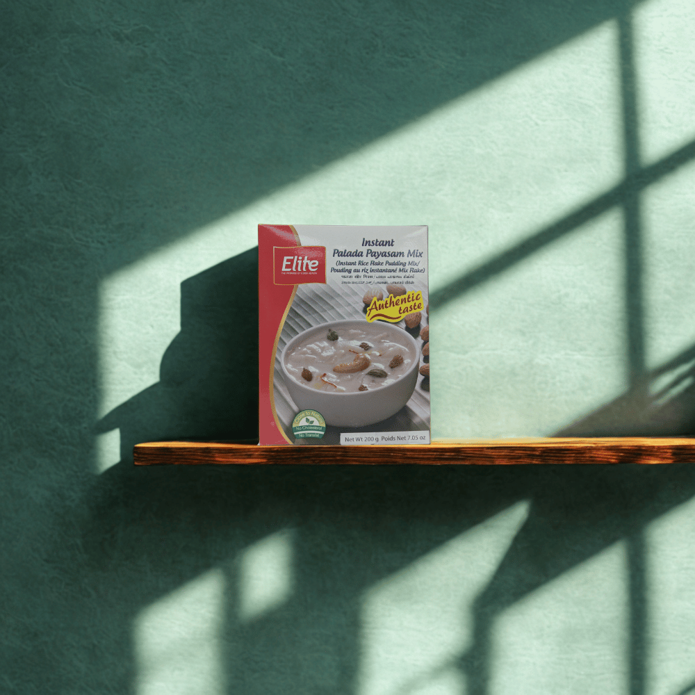 Box of Elite Palatine Pudding Mix on a wooden shelf with a green wall background