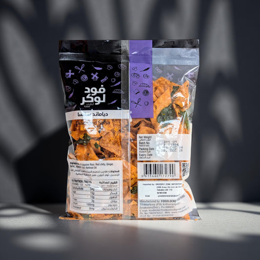 Three packages of food with labels on a dark background