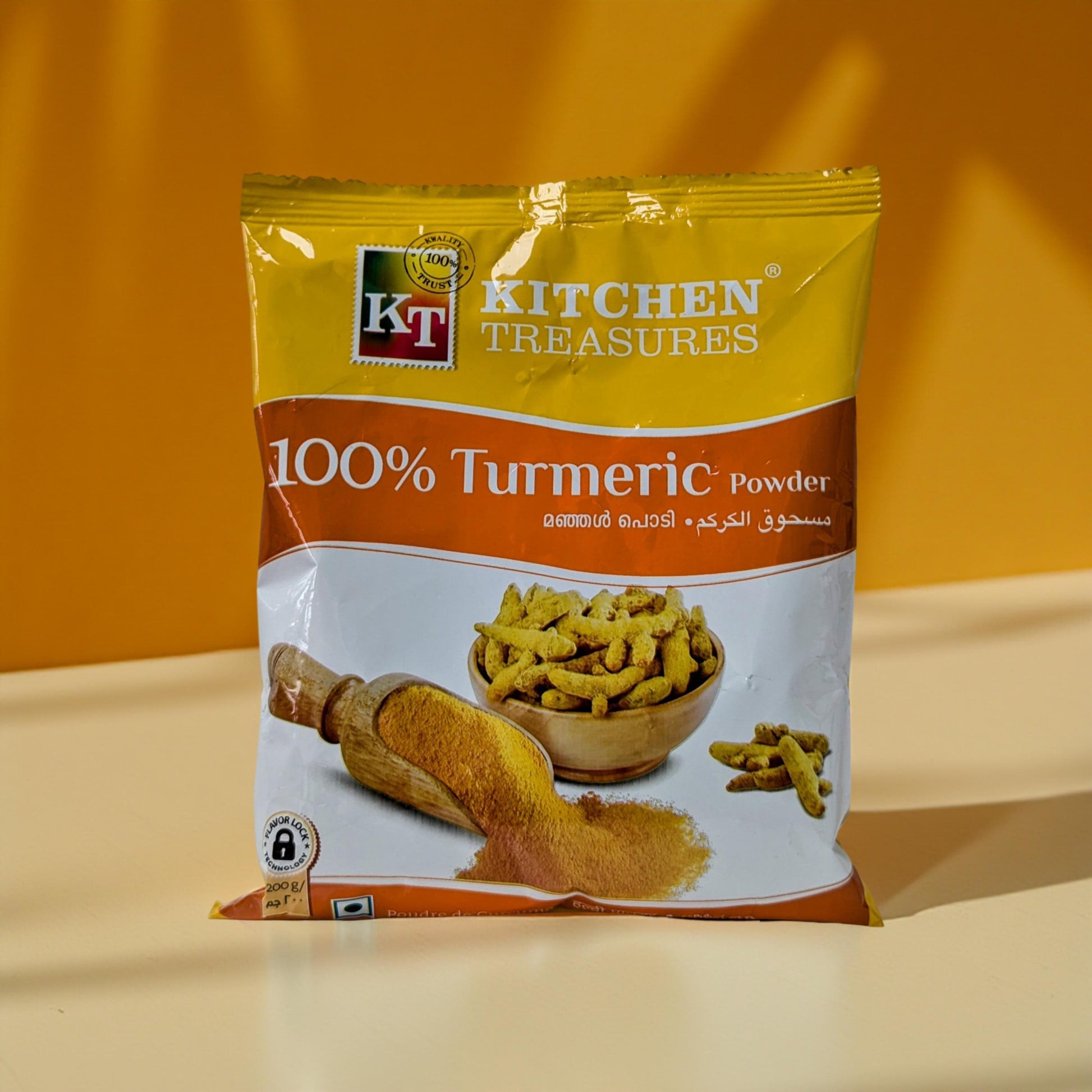 KT Kitchen Treasures 100% Turmeric Powder package on a yellow background