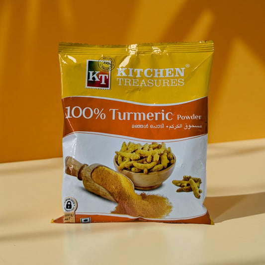 KT Kitchen Treasures 100% Turmeric Powder package on a yellow background