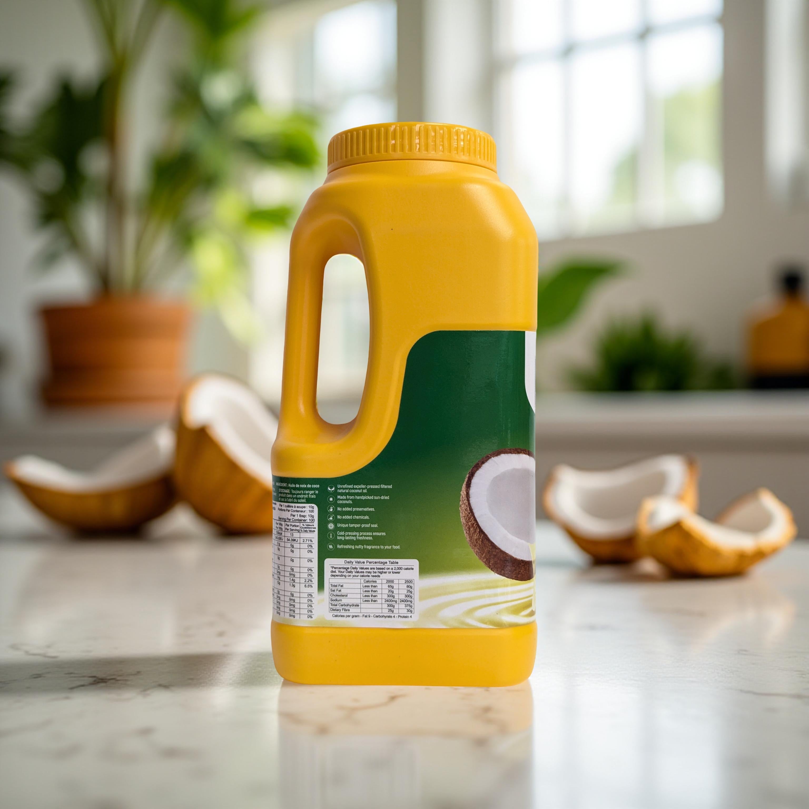Yellow bottle of coconut milk on a marble surface with coconut halves and plants in the background