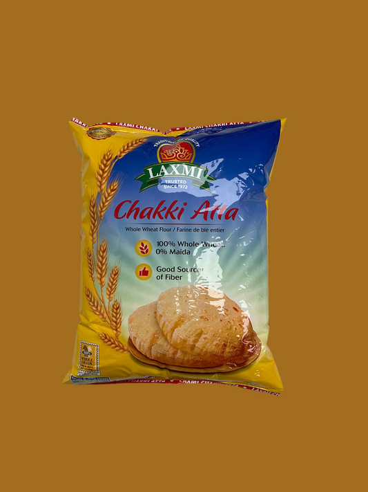 Laxmi Chakki Atta packaging on a yellow background