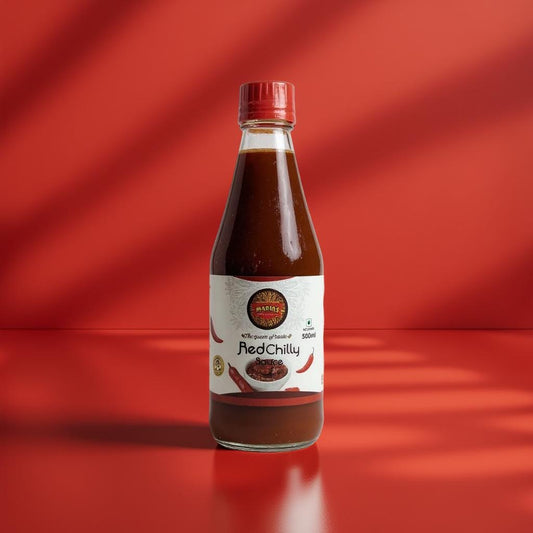 Bottle of Red Chilly sauce on a red background