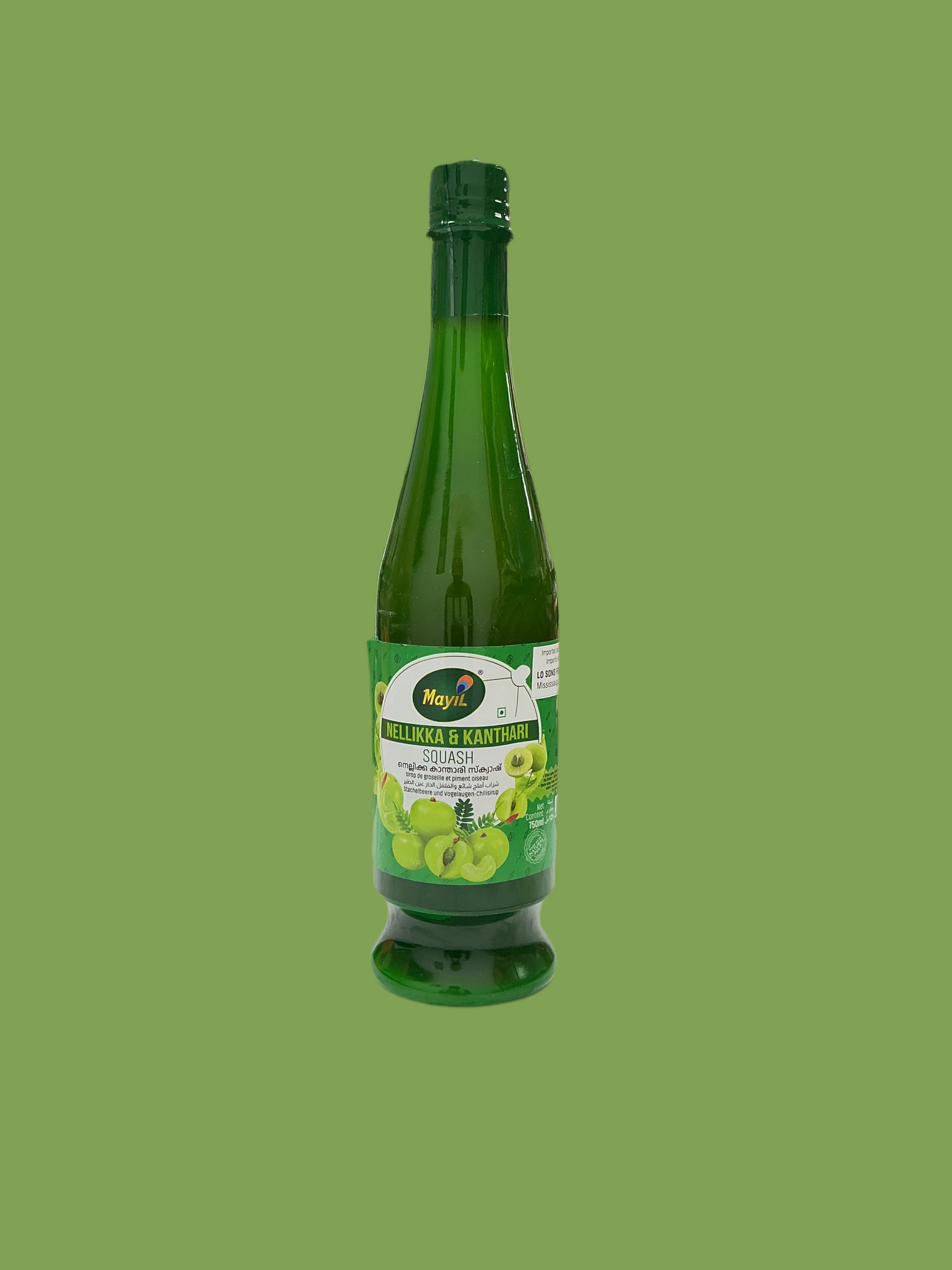 Green bottle of juice with a label on a green background