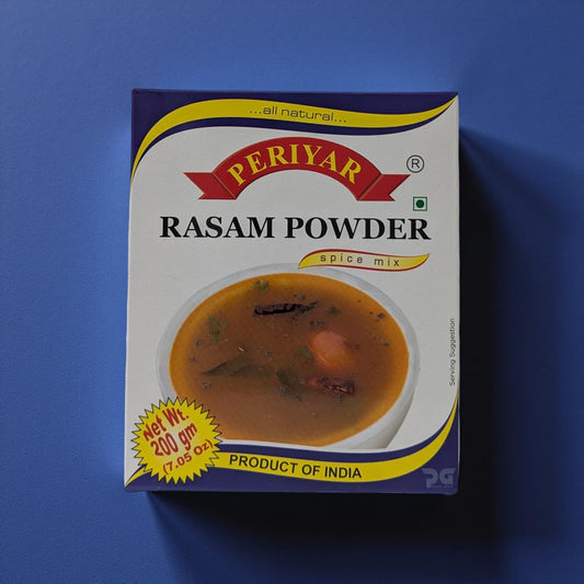 Periyar Rasam Powder spice mix packaging on a blue background