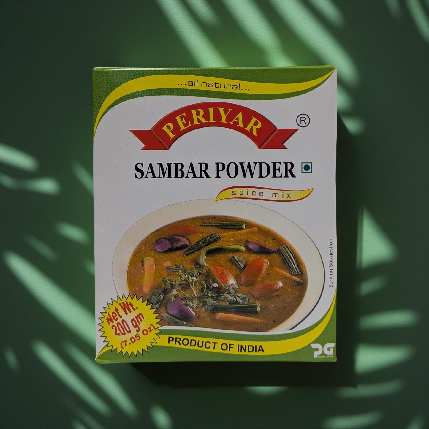 Periyar Sambar Powder spice mix packaging on a green leafy background