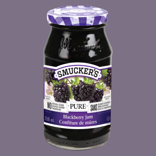Jar of Smucker's Blackberry Jam on a gray background