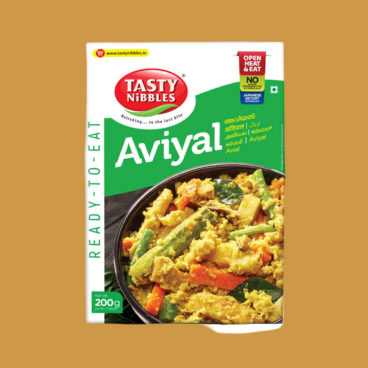 Tasty Nibbles Aviyal packaging on a brown background