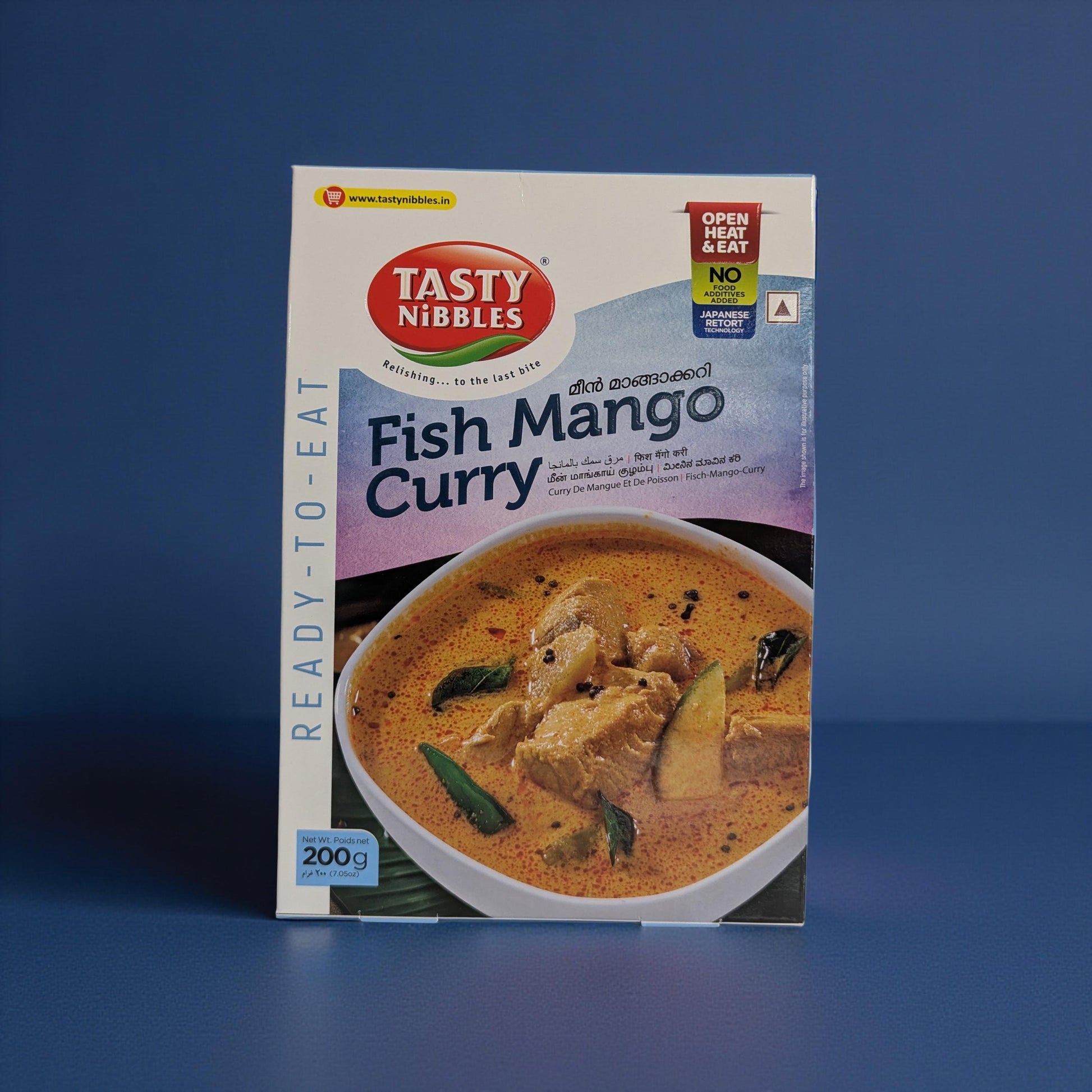 Tasty Nibbles Fish Mango Curry packaging on a blue background