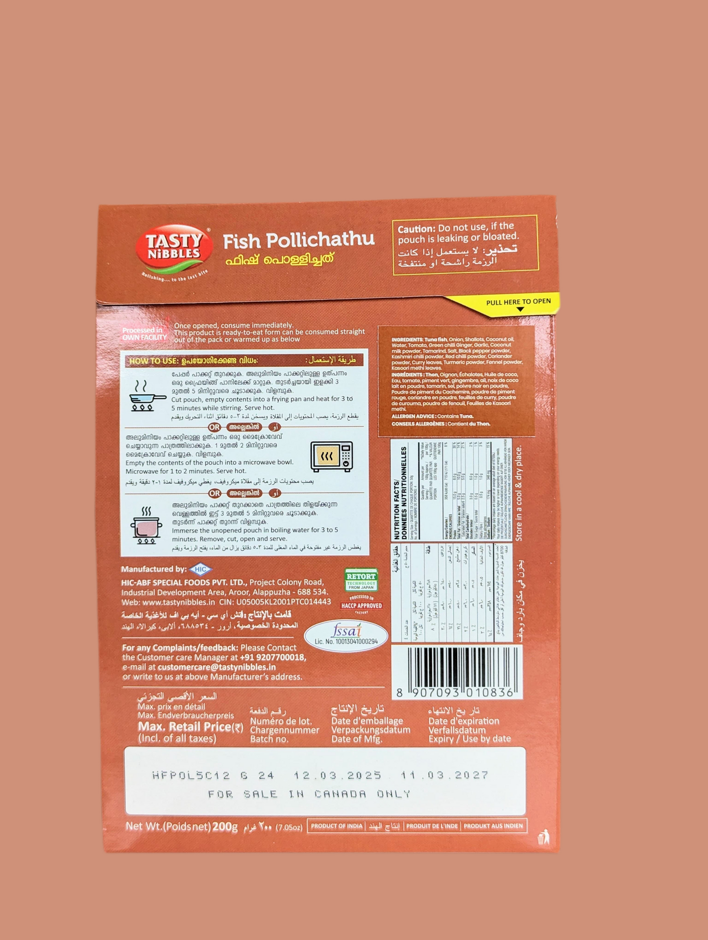 Back view of a Tasty India Fish Pollichathu packaging with text and labels on a brown background