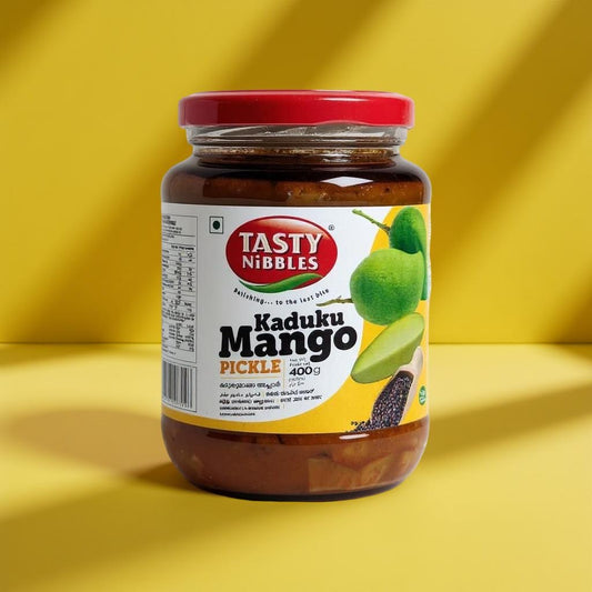 Jar of Tasty Nibbles Kaduku Mango Pickle on a yellow background