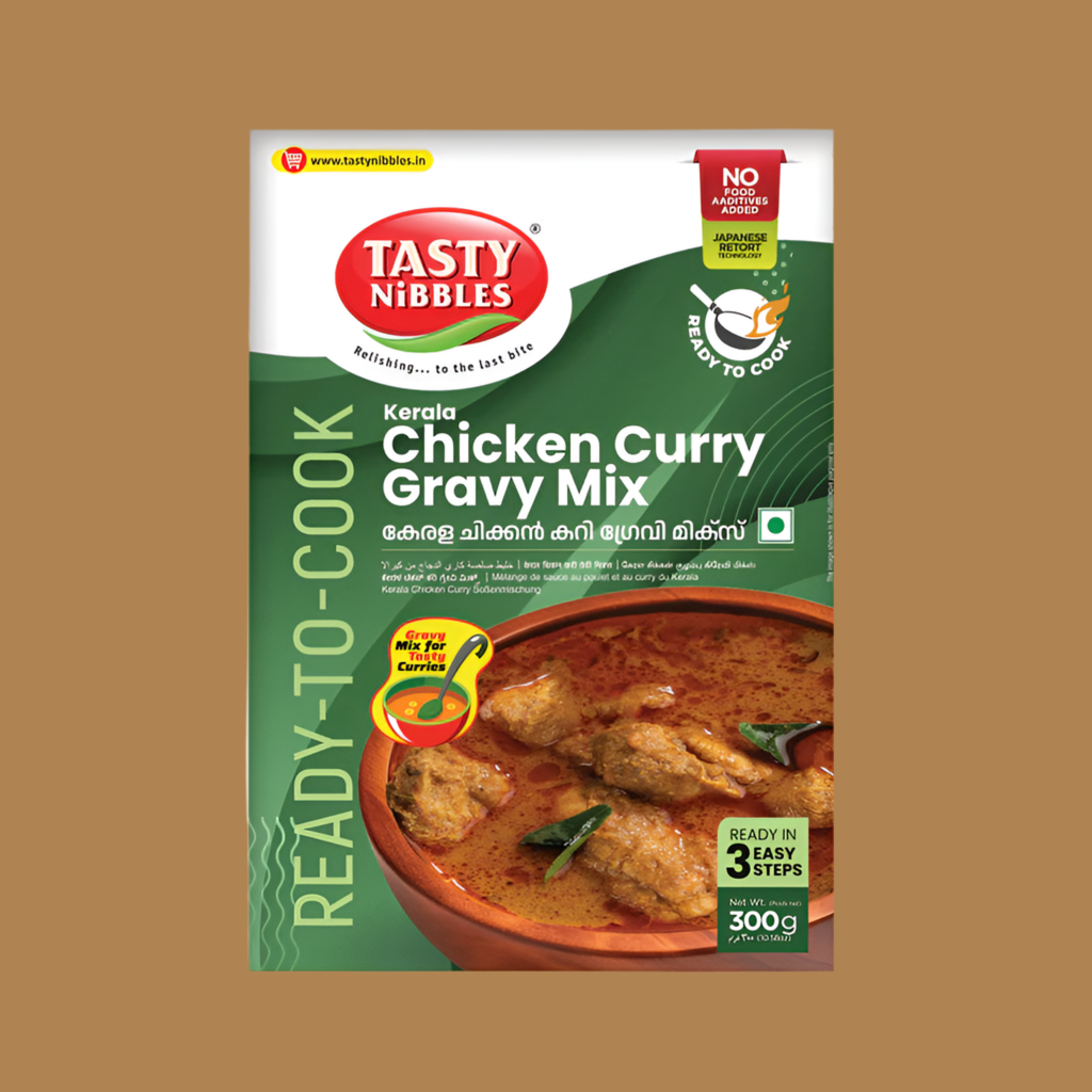 Tasty Nibbles Kerala Chicken Curry Gravy Mix packaging on a brown background