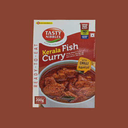 Tasty Nibbles Kerala Fish Curry packaging on a brown background
