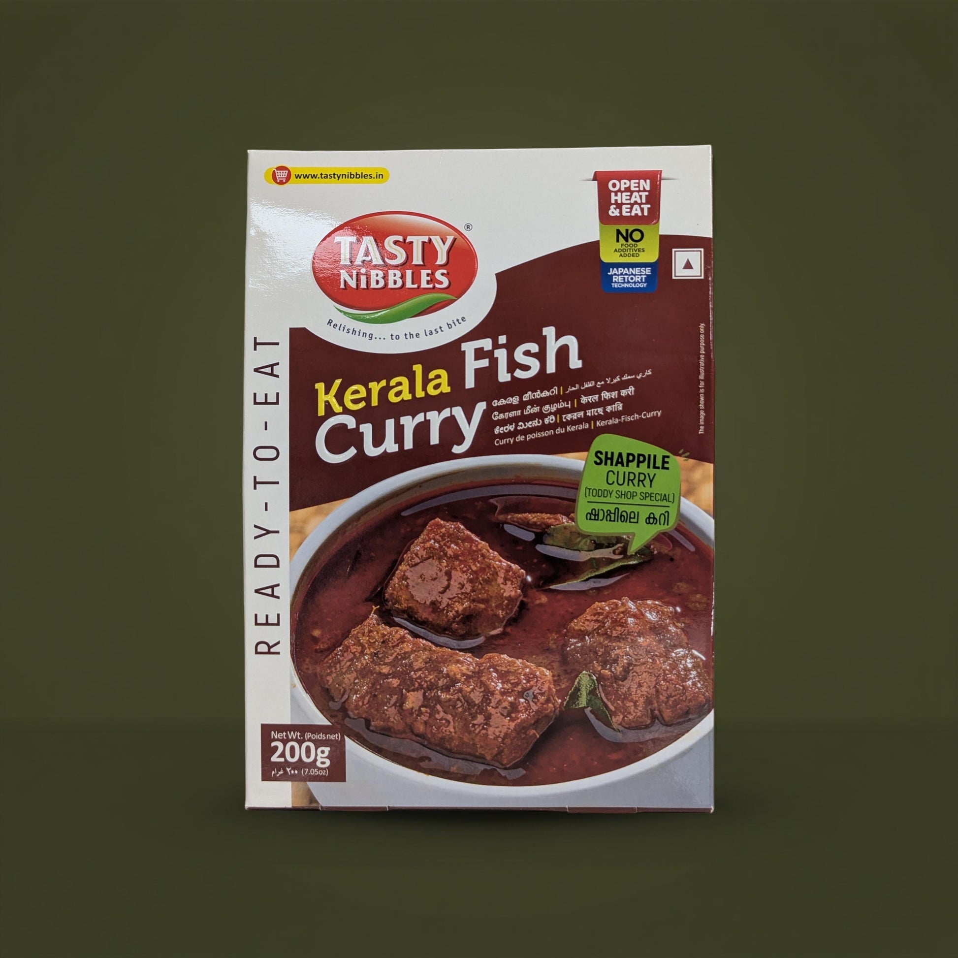 Tasty Nibbles Kerala Fish Curry packaging on a dark green background