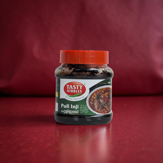 Jar of Tasty Nibbles Puli Inji on a red background